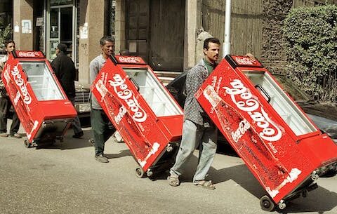 Coca-Cola's biggest challenge in greening its operations is its own global marketing strategy