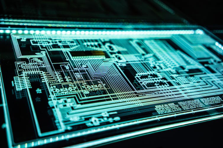 A teal-green schematic on a black background computer screen.