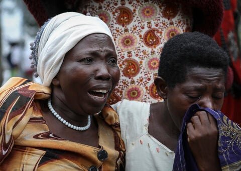 Ugandan border town prepares to bury victims of rebel massacre that left 42 dead, mostly students