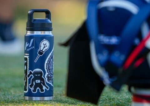 Stickers adorn Rickie Fowler's ever-present water bottle at US Open