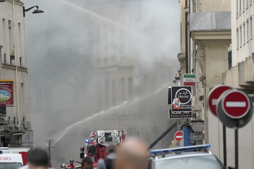 Explosion hits a building in Paris, injuring four people. Police are trying to determine the cause