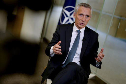 NATO wants to fight climate change. Its chief tells AP the trick is to make armies green but strong