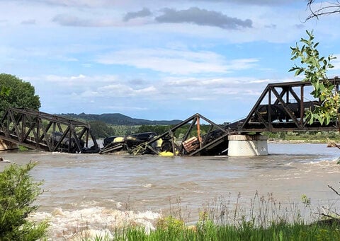 A bridge over Yellowstone River collapses, sending a freight train into the waters below