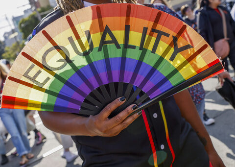 Party and protest mix as LGBTQ+ pride parades kick off from New York to San Francisco