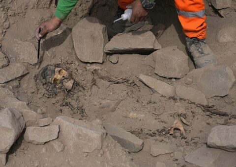 Archeologists find mummy surrounded by coca leaves on hilltop in Peru's capital