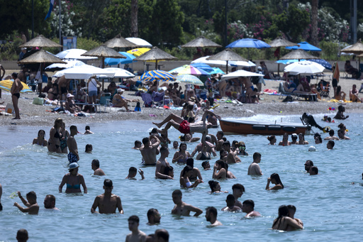 People and pets seek shade and cool as Europe sizzles under heat wave that's only going to get worse