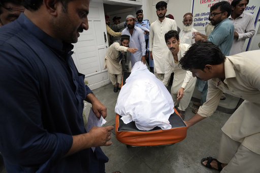 11 dead after a wall collapses near an under-construction bridge in Pakistan during monsoon rains