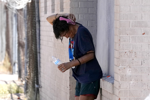 Little relief in sight from onslaught of searing heat and rising floodwaters in parts of US, 2 dead