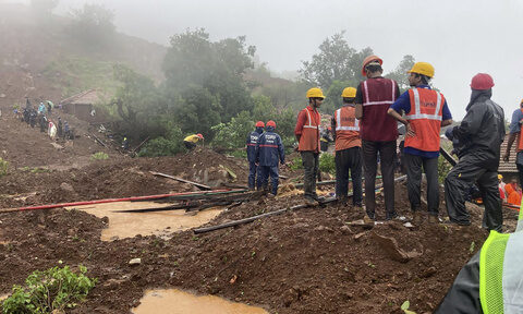 Landslide triggered by heavy rains kills 10 and traps many others in western India