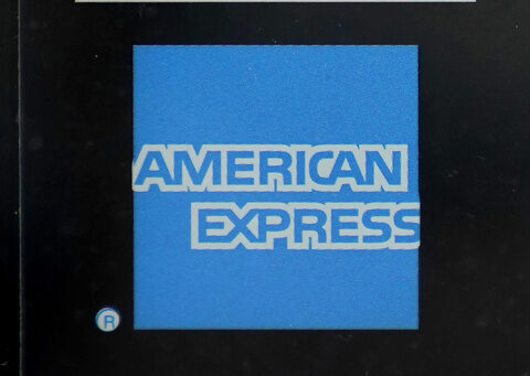 American Express profit rises, but it sets aside more money for possible defaults