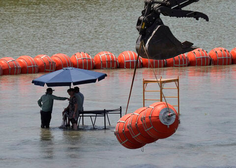 Justice Department tells Texas that floating barrier on Rio Grande raises humanitarian concerns