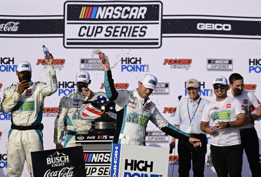 Denny Hamlin courts controversy, counts victories at Pocono after milestone 50th win in Cup