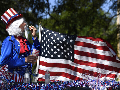 Revelers across the US brave heat and heavy downpours to celebrate Fourth of July