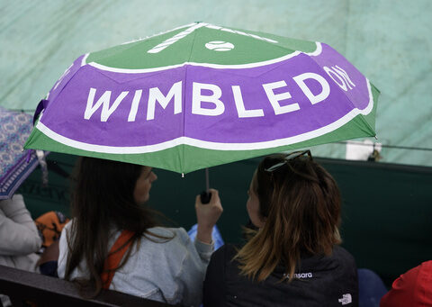 Rain again affects play at Wimbledon day but matches go ahead under the roof on Centre Court