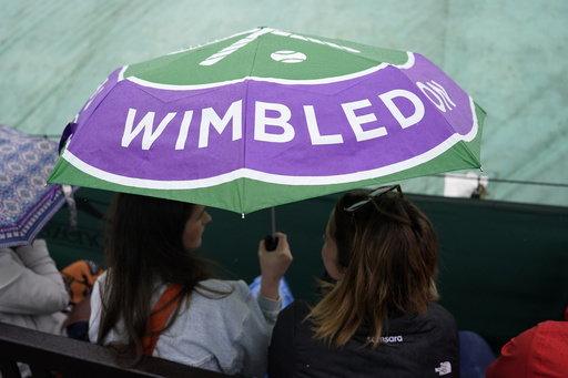 Rain again affects play at Wimbledon day but matches go ahead under the roof on Centre Court