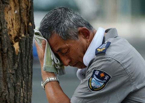 Beijing orders outdoor work to be halted as scorching summer heat soars