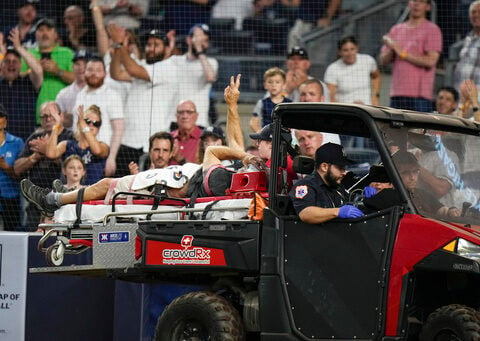 Cameraman injured at Yankee Stadium by wild throw has broken eye socket