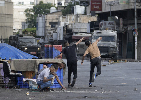 Israeli forces kill 2 Palestinians in shootout in the occupied West Bank