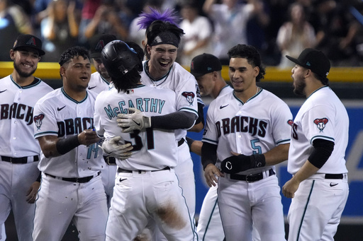 Carroll drives in winning run in the 10th in the Diamondbacks' 3-2 victory over the Pirates