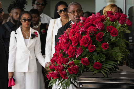 Friends and family gather for the funeral of Houston rapper Big Pokey