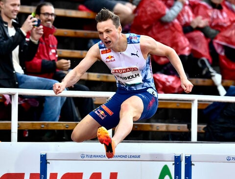 Olympic champion Warholm boos protesters on track who disrupted his 400-meter hurdles race