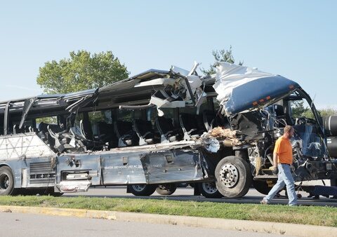 3 dead and 14 injured in Illinois crash involving Greyhound bus and tractor-trailers, police say