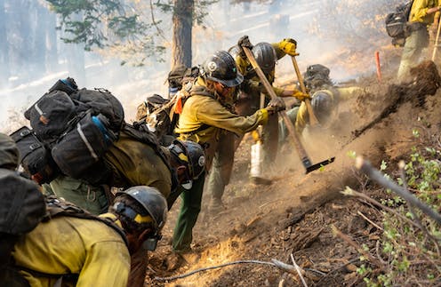 Yellow jerseys of the fireline: A day fighting wildfires can require as much endurance as riding the Tour de France