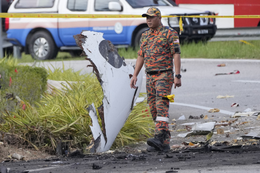 Small plane crashes on a Malaysian highway, killing all 8 people on board and 2 on the ground