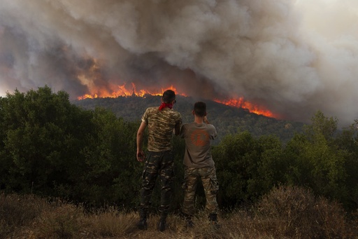 Major wildfires sweeping through forests in Greece force evacuations near Athens and the northeast