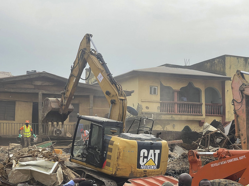 Building collapse in Nigeria's capital leaves two people dead while many are feared trapped