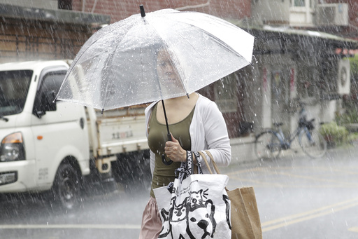 Trains suspended, people warned away from the coastline as Typhoon Saola churns toward south China