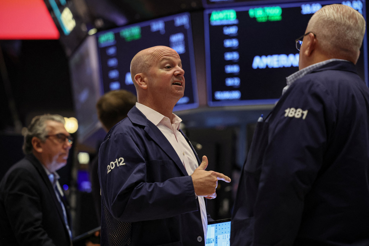 Traders work on the floor of the NYSE in New York