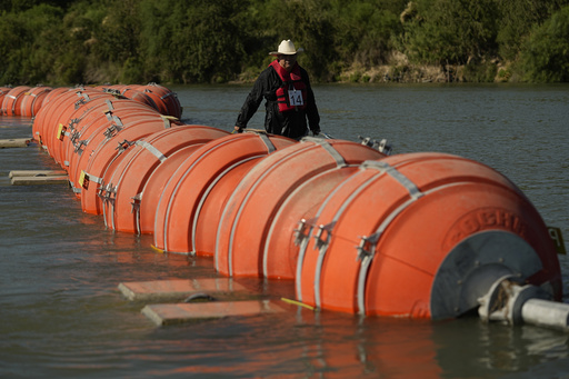 A judge orders Texas to move a floating barrier that's used to deter migrants between US and Mexico