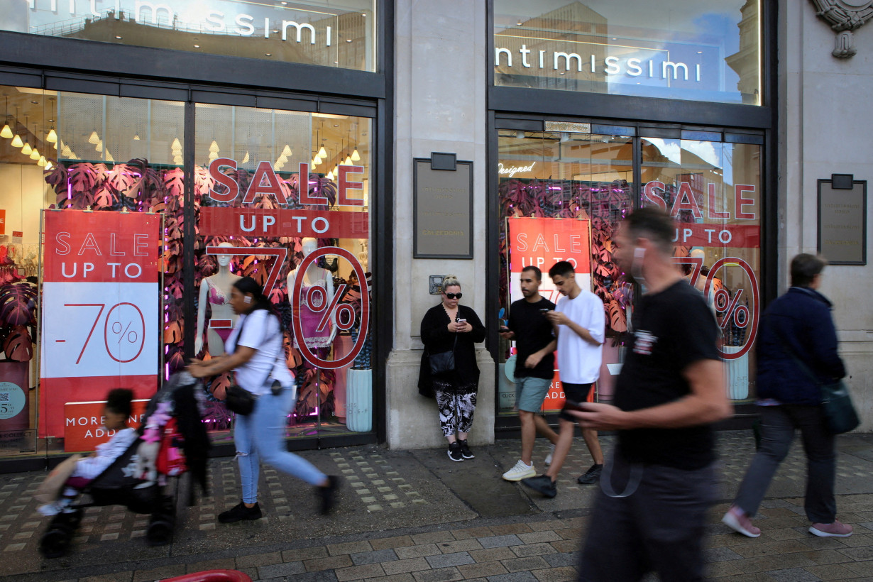 Heavy winter sweaters, coats pile up at stores as warm weather threatens holiday shopping season