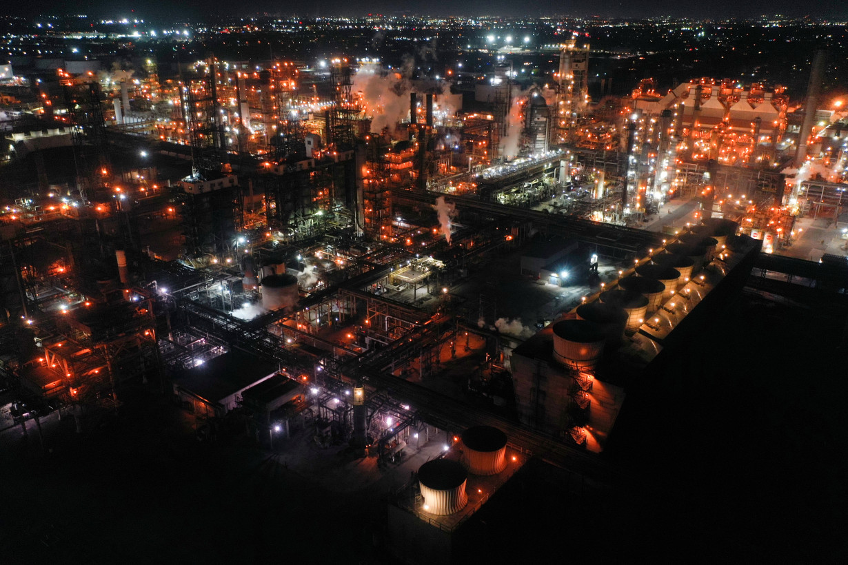 Nighttime view of oil refinery run by PBF Energy