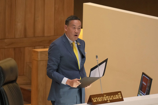 Thailand's new prime minister tells Parliament his government will urgently tackle economic woes