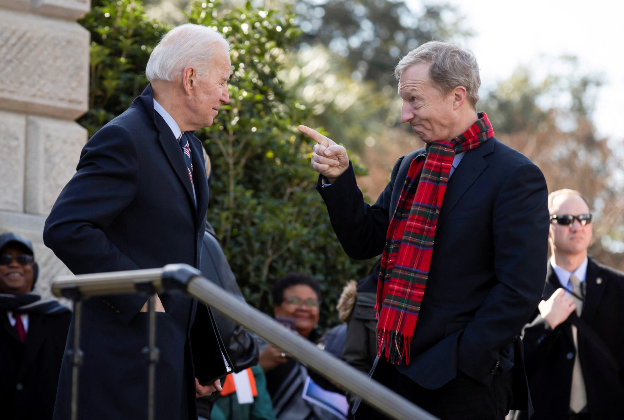 FILE PHOTO: Democratic U.S. presidential candidate Tom Steyer speaks with fellow Democratic U.S. presidential candidate and former U.S. Vice President Joe Biden during the Martin Luther King Jr. Day parade in Columbia