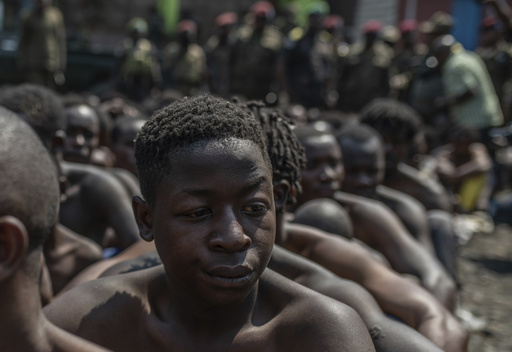 Two military officers are arrested in Congo for leading a protest crackdown that killed 43 people