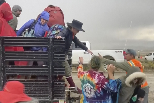 Wait times to exit Burning Man drop after flooding left tens of thousands stranded in Nevada desert