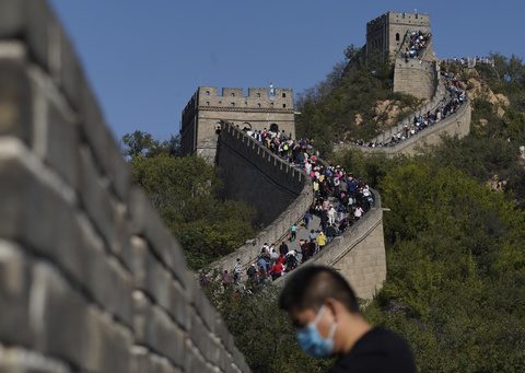 China authorities arrest 2 for smashing shortcut through Great Wall with excavator