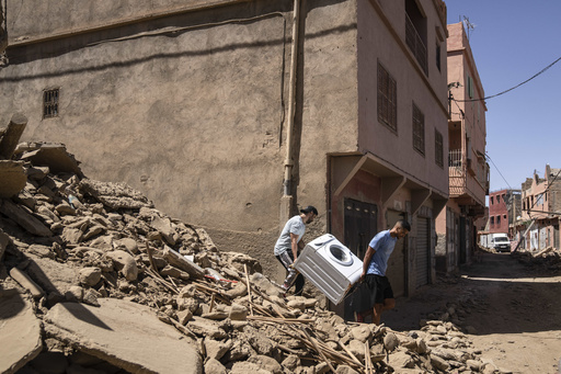 Moroccan soldiers and aid teams battle to reach remote, quake-hit towns as toll rises past 2,400