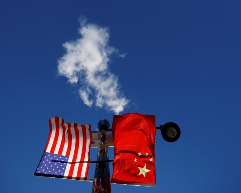 The flags of the United States and China fly in Boston