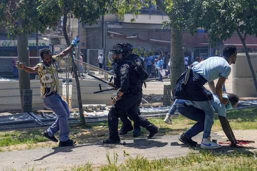 Dozens injured in a protest by asylum-seekers outside Eritrean Embassy in Israel