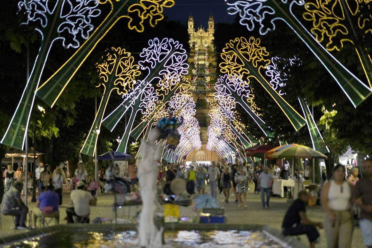 Ox-pulled floats with sacred images of Mary draw thousands to Portugal’s wine-country procession