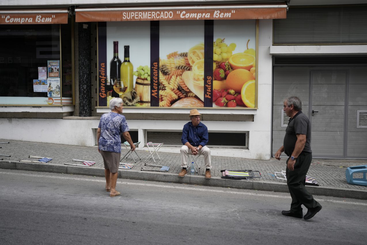 Ox-pulled floats with sacred images of Mary draw thousands to Portugal’s wine-country procession