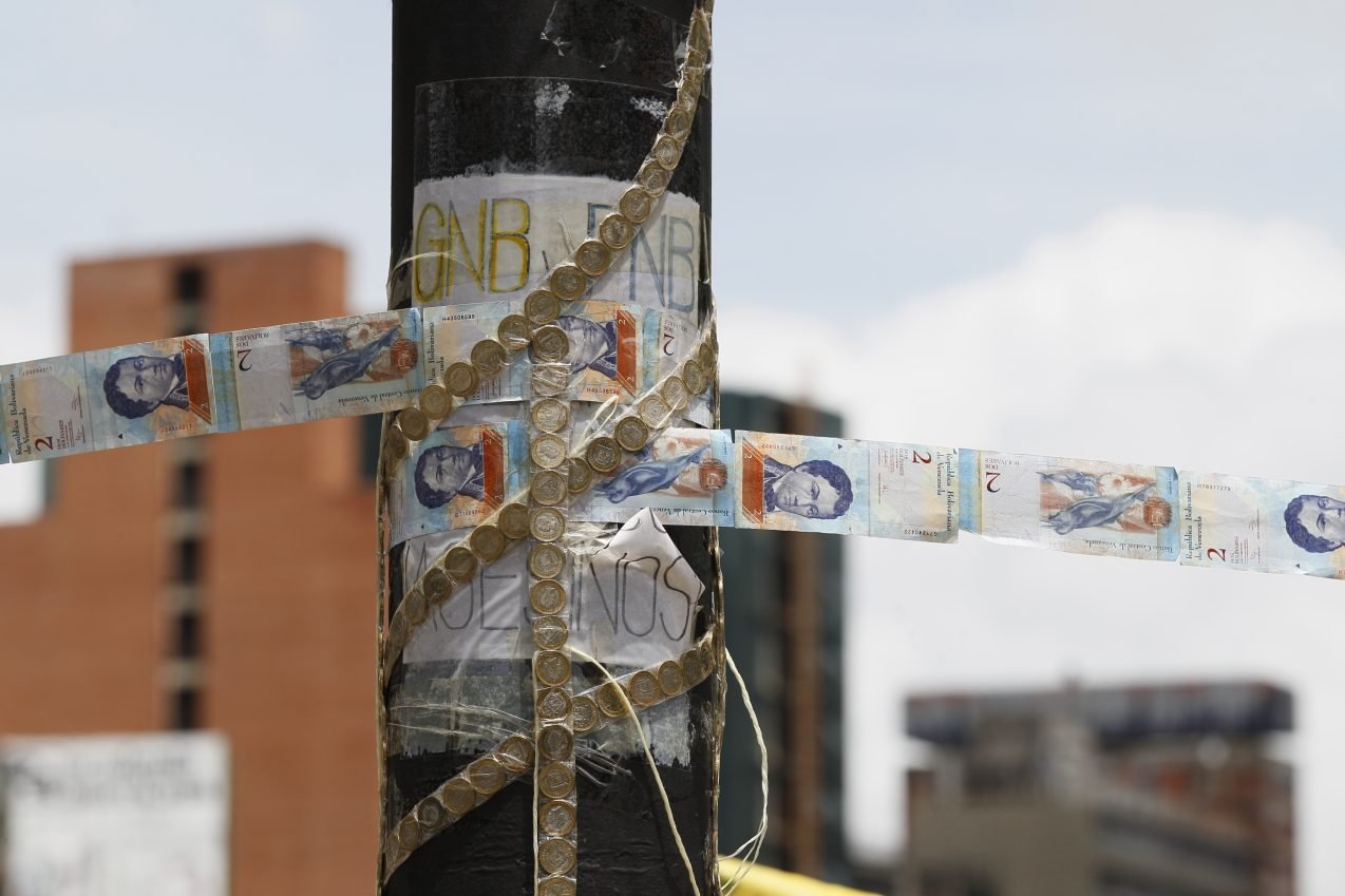 Paintings on pesos illustrate Argentina's currency and inflation woes