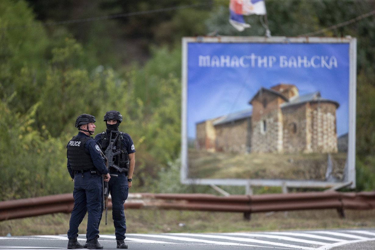 Kosovar police surround a village after Serb gunmen storm a monastery in violence that has killed 4