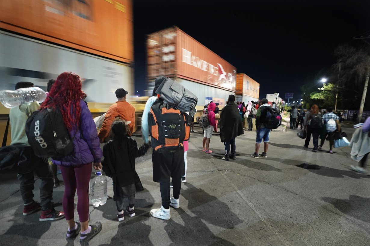 Migrants hoping to reach US continue north through Mexico by train amid historic migration levels