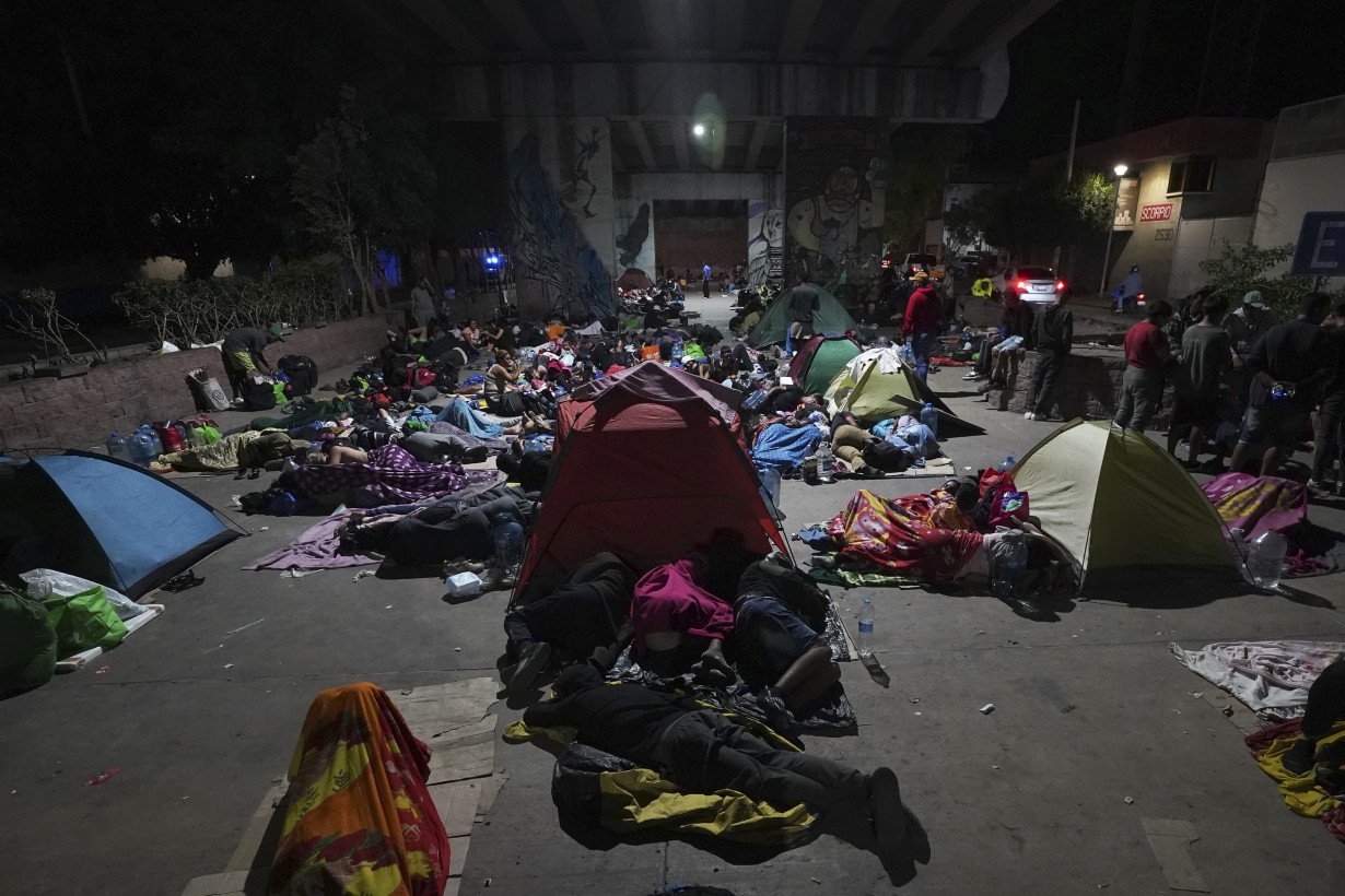 Migrants hoping to reach US continue north through Mexico by train amid historic migration levels