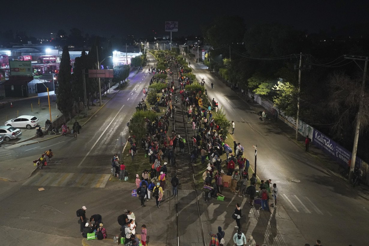 Migrants hoping to reach US continue north through Mexico by train amid historic migration levels